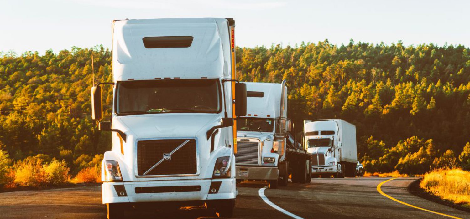 white-volvo-semi-truck-on-side-of-road-2199293